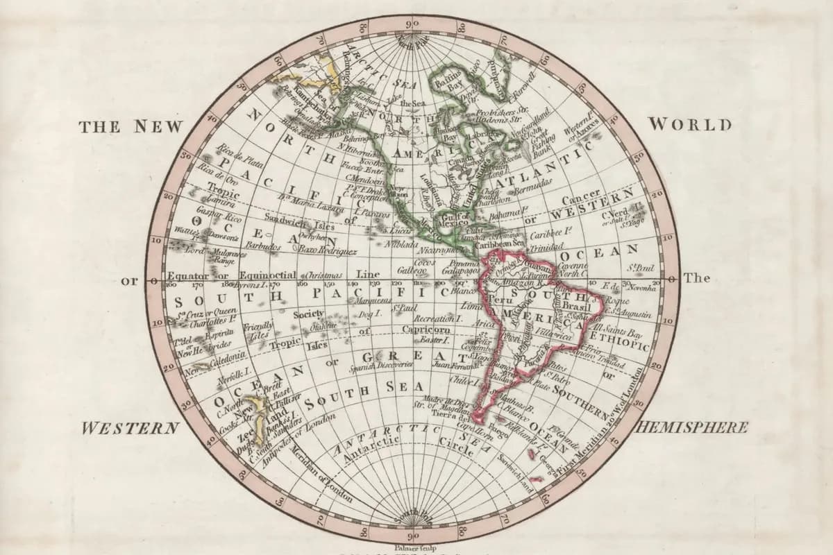 Un antico atlante celeste aperto su un tavolo da biblioteca con accanto una moderna mappa stellare